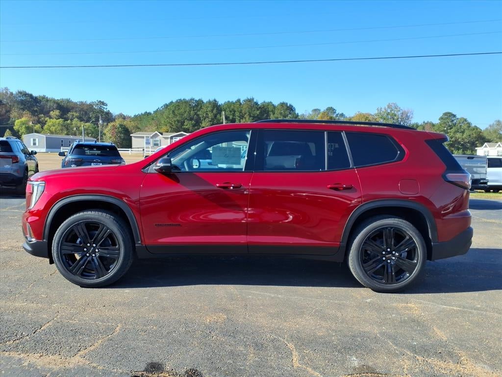 2026 GMC Acadia Elevation in Volcanic Red Tintcoat — front three-quarter view