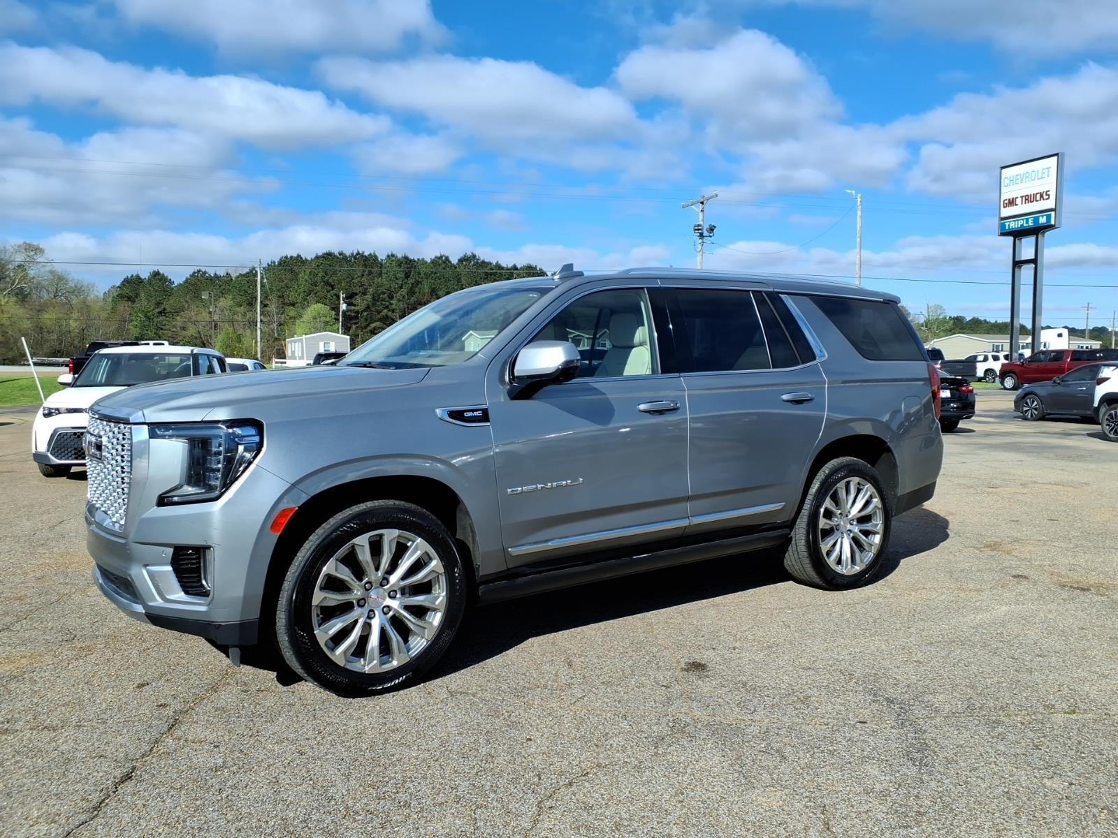 2023 GMC Yukon Denali in Sterling Metallic — front three-quarter view