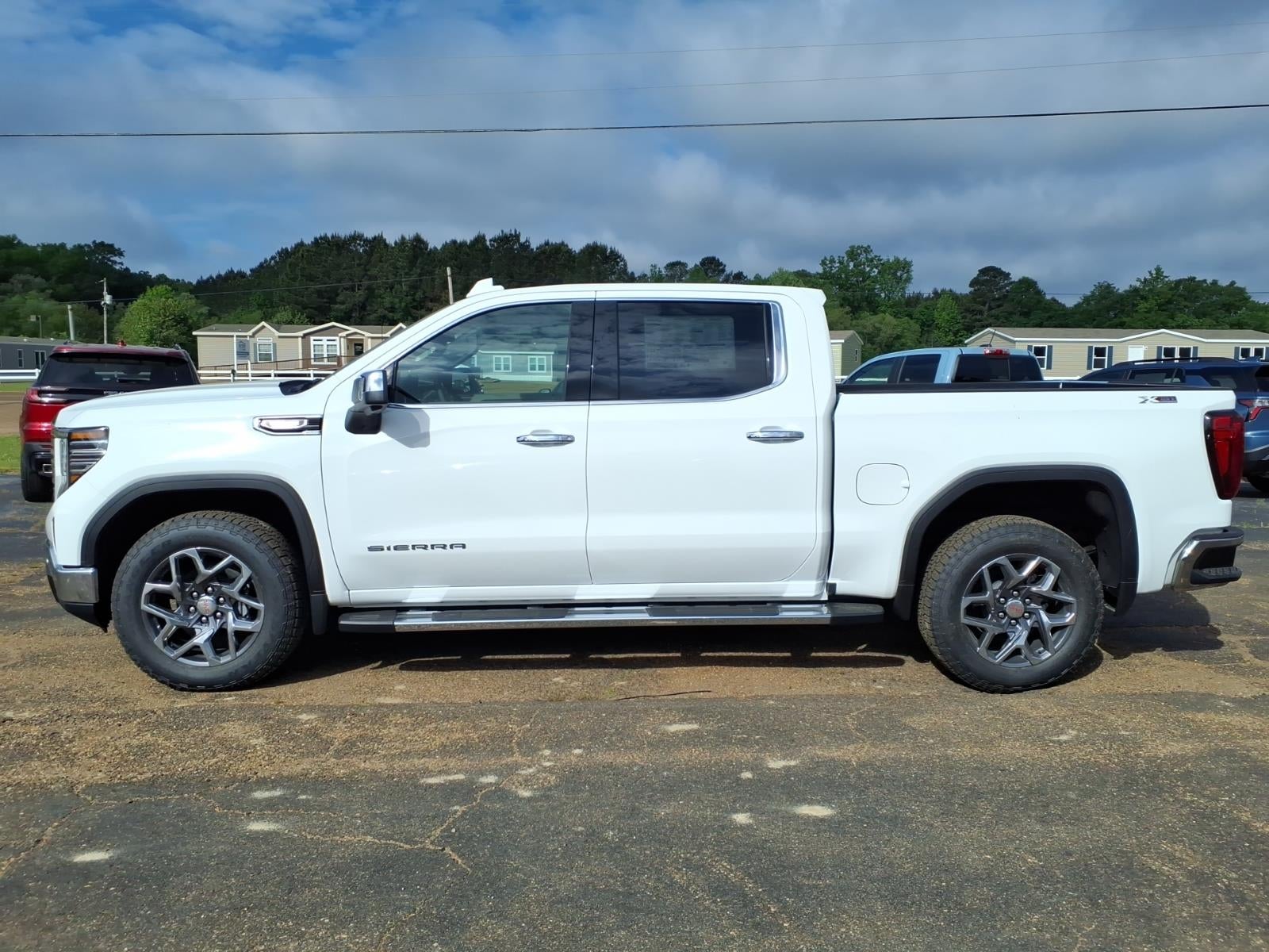 2026 GMC Sierra 1500 SLT in Summit White — front three-quarter view