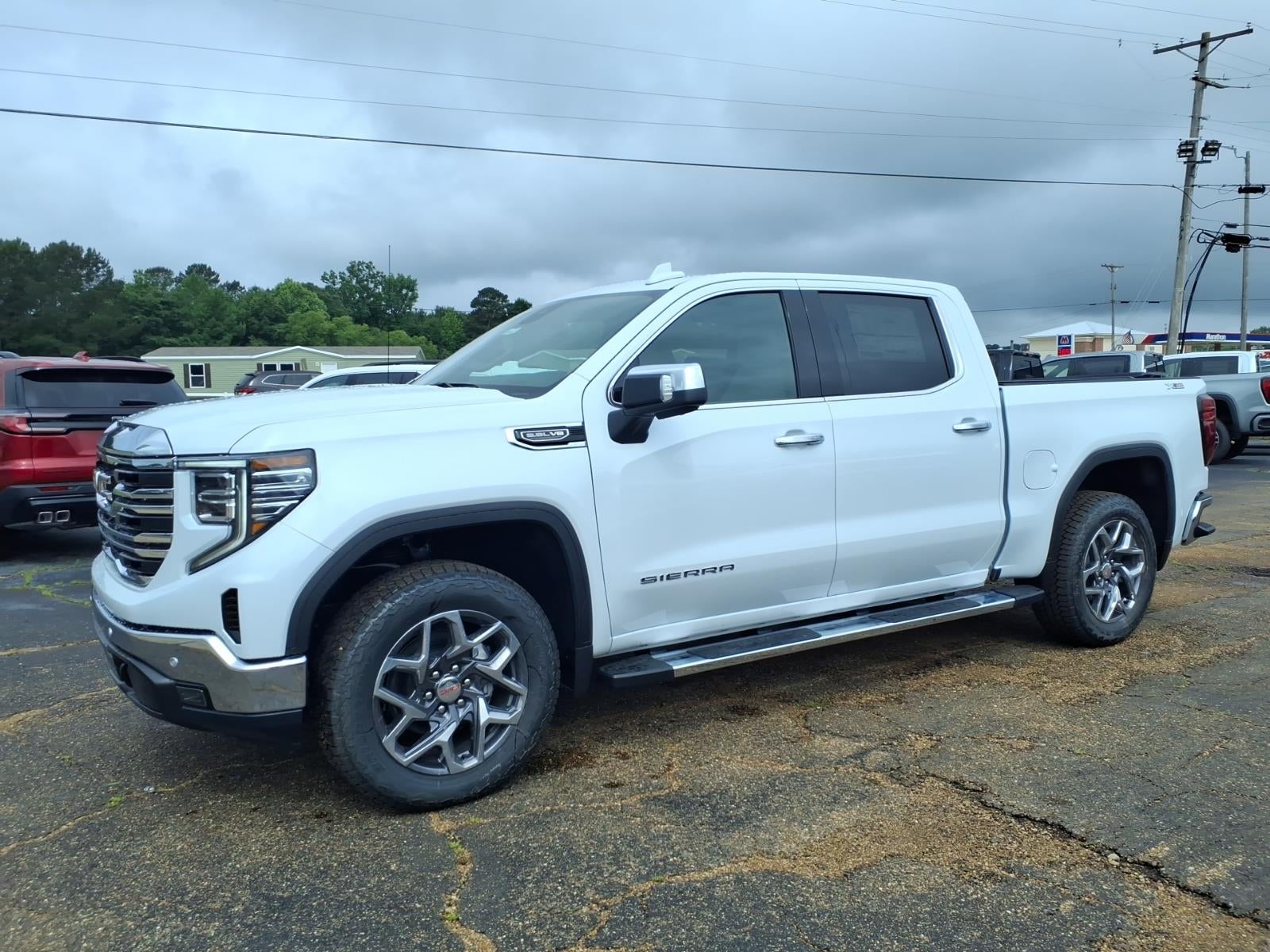2026 GMC Sierra 1500 SLT in Glacier White Tricoat — front three-quarter view