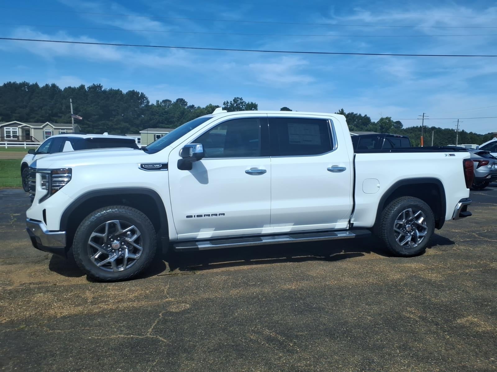 2026 GMC Sierra 1500 SLT in Summit White — front three-quarter view
