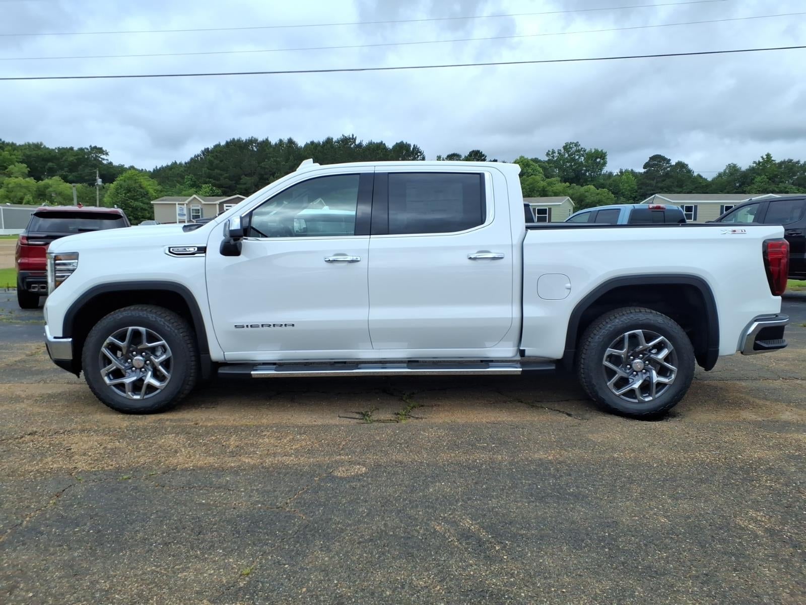 2026 GMC Sierra 1500 SLT in Summit White — front three-quarter view