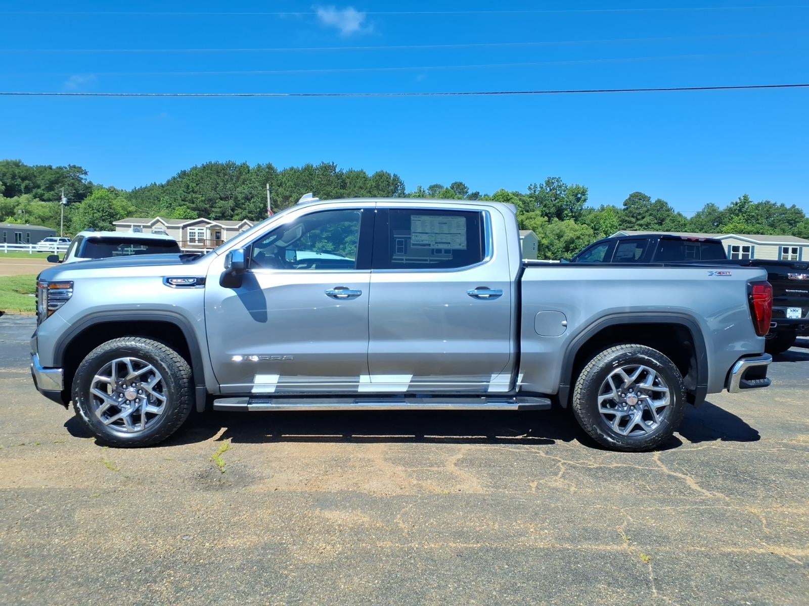 2026 GMC Sierra 1500 SLT in Sterling Metallic — front three-quarter view