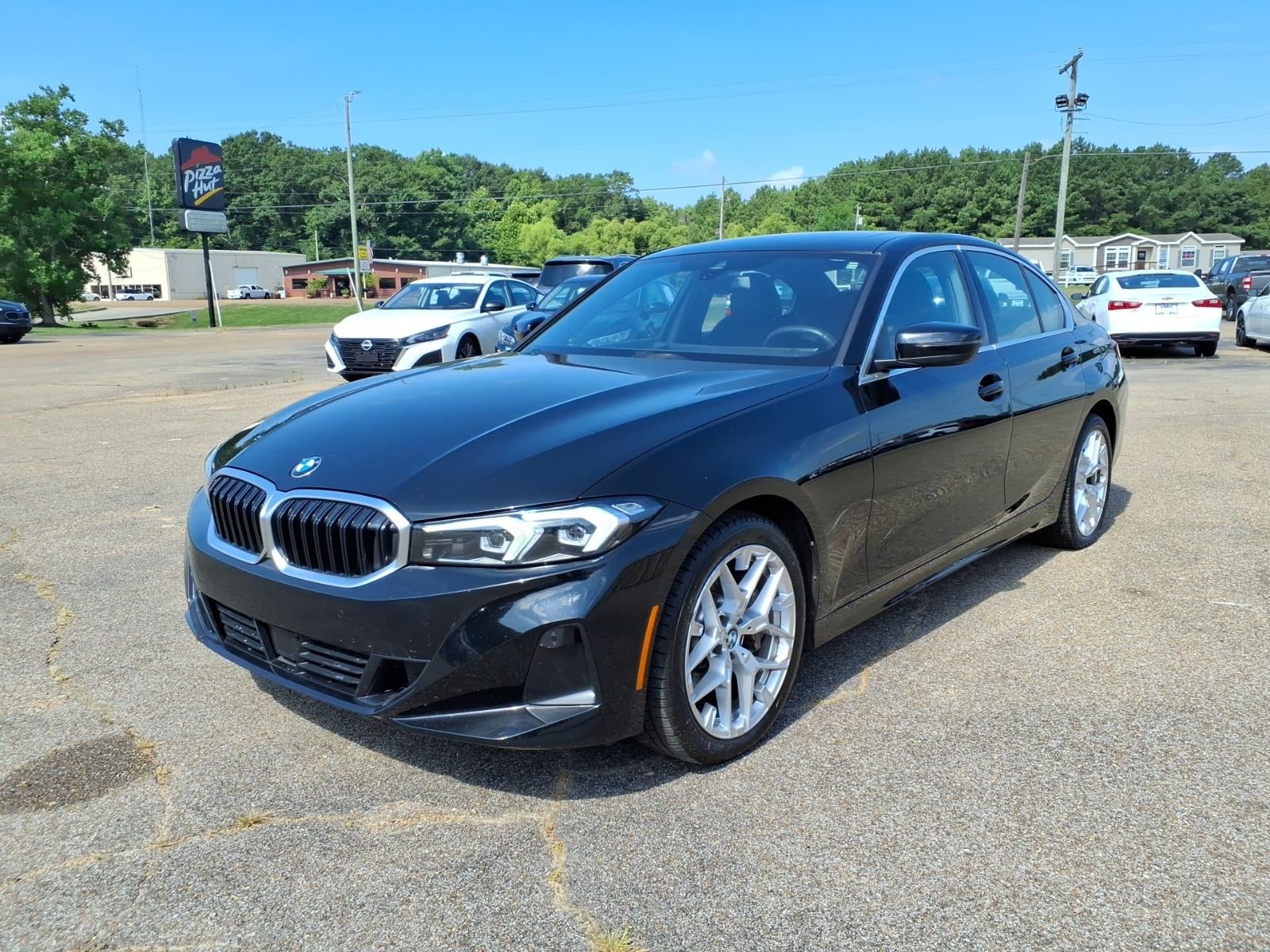 2025 BMW 3 Series 330i in Blue — front three-quarter view