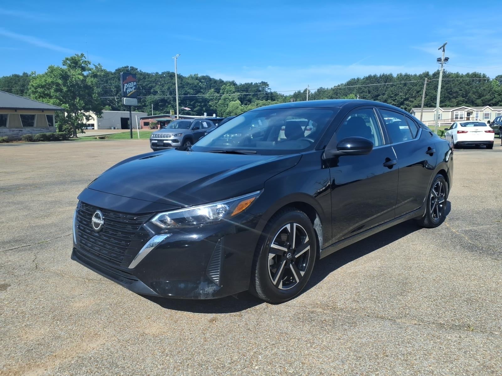 2024 Nissan Sentra SV in Black — front three-quarter view